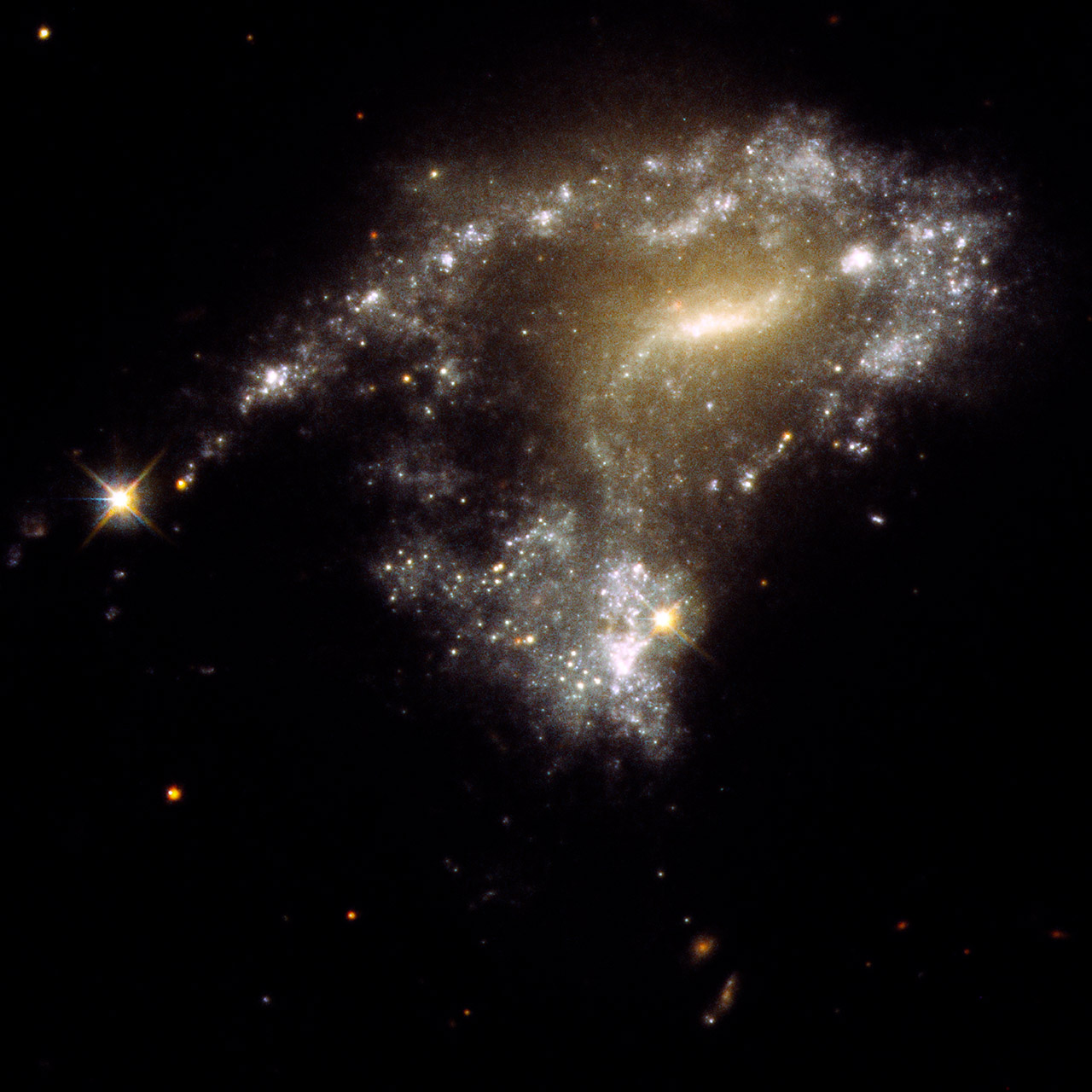 Hubble Captures 12 Interacting Galaxies That Look Like a String of ...