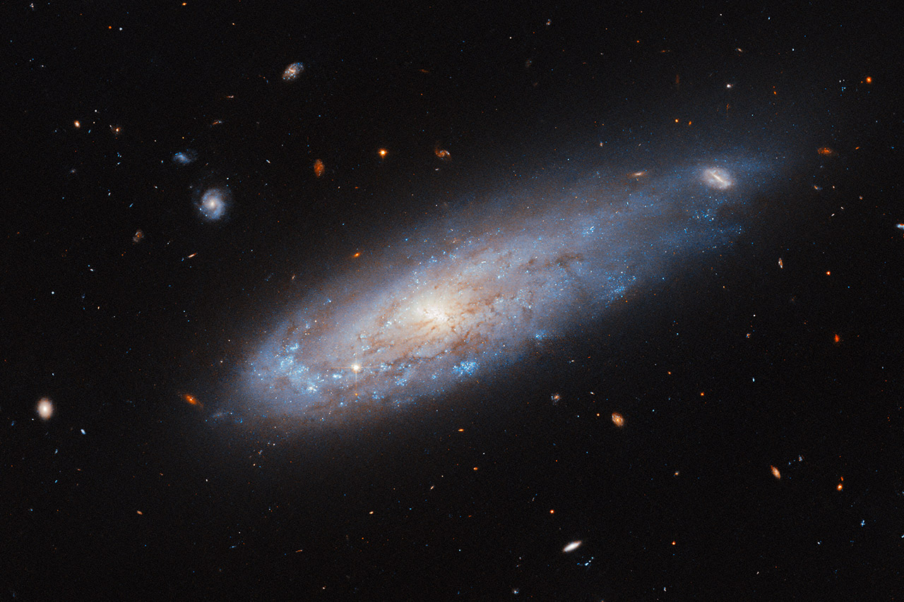 Hubble Captures CannonballLike Spiral Galaxy IC 3225 Located 100