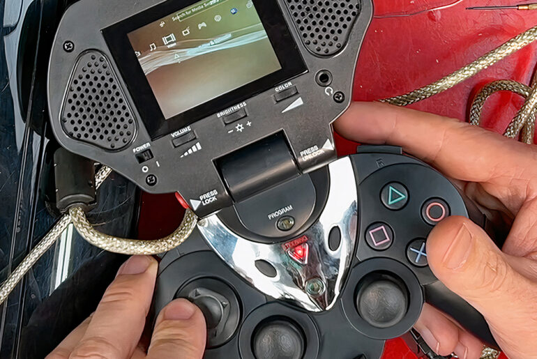 Original PlayStation Portal Intech Controller and Game Screen