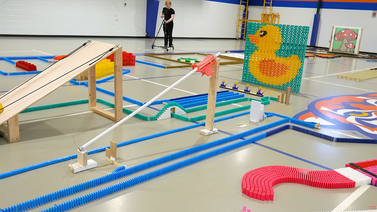 Guinness World Records Most Dominoes Toppled in 3D Pyramid